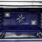 Interior view of the FORNO 48-inch gas range from the 2-Piece Appliance Package, showing dual oven cavities with stainless steel interiors, multiple rack positions, convection fans, and interior lighting—designed for even cooking and versatile baking performance.