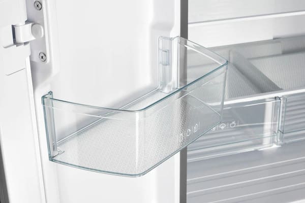 Close-up of the door bin inside the FORNO 30-inch French door refrigerator in stainless steel, highlighting storage space for bottles and condiments.