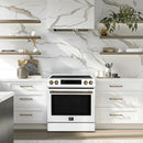 Lifestyle image of the FORNO 30-Inch Induction Range in White, installed in a modern kitchen setting with coordinating cabinetry and décor, showcasing its sleek design and professional appearance.