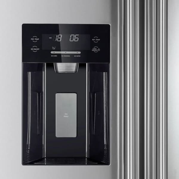 Close-up of the ice maker inside the FORNO 36-inch side-by-side refrigerator in stainless steel, showing the ice storage bin and dispensing mechanism.