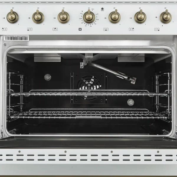 Interior view of the FORNO Antico 36-Inch Gas Range in white, featuring a vibrant blue enamel oven cavity, convection fan, and heavy-duty racks for multi-level cooking.
