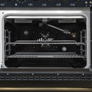Interior view of the main oven in the FORNO Antico 48-Inch Dual Fuel Range in black, featuring a spacious blue enamel cavity, convection fan, and durable multi-rack configuration.