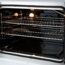 Close-up of the oven interior in the FORNO Galiano 30-Inch French Door Dual Fuel Range in white, highlighting the stainless steel telescopic oven racks and blue enamel cavity.