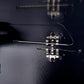 Close-up view of the thermostat dial on the FORNO Marco 36-Inch Gas Range in black, featuring clear temperature markings and a stainless steel knob with a sleek bezel for precise oven control.