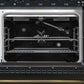 Interior view of the main oven in the Forno Antico 48-Inch Gas Range, showcasing a vibrant blue enamel cavity, convection fan, and multi-level heavy-duty oven racks for versatile cooking.
