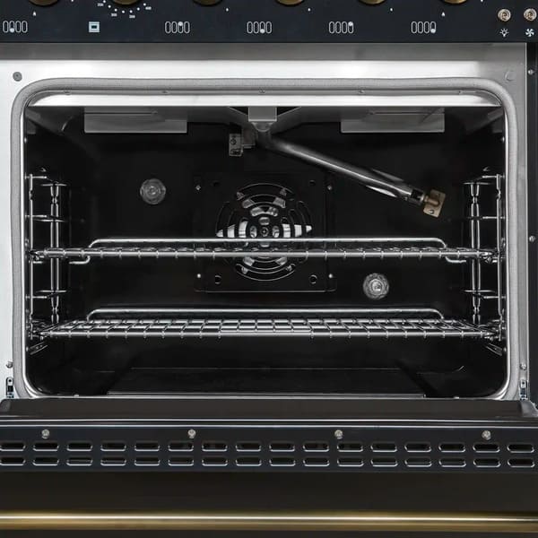 Interior view of the main oven in the Forno Antico 48-Inch Gas Range, showcasing a vibrant blue enamel cavity, convection fan, and multi-level heavy-duty oven racks for versatile cooking.