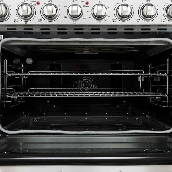 Close-up view of the interior of the Forno Paolo 36-Inch Electric Range with Convection Oven, highlighting the convection fan, blue enamel cavity, and durable oven racks.