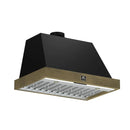 Angled view of the Forno Vittorio Wall Mount Range Hood, highlighting its modern silhouette, antique brass trim accents, and seamless integration of baffle filters and LED lighting beneath the hood.