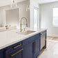 The ZLINE Dishwasher placed in a marble and blue themed kitchen